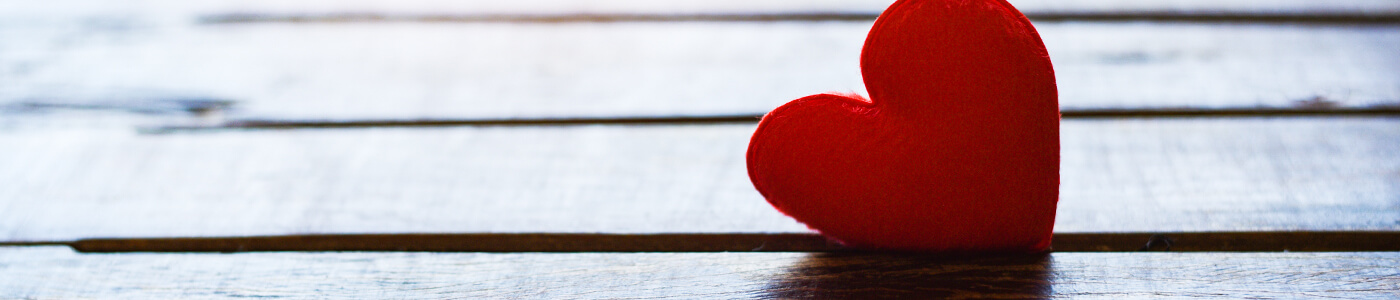 Red heart on wood